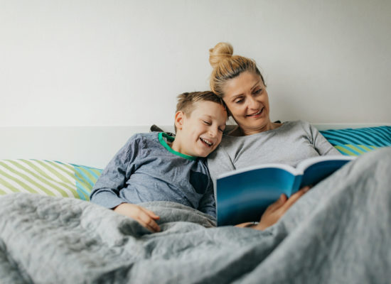 Mother and son in bedroom spend some quality time
